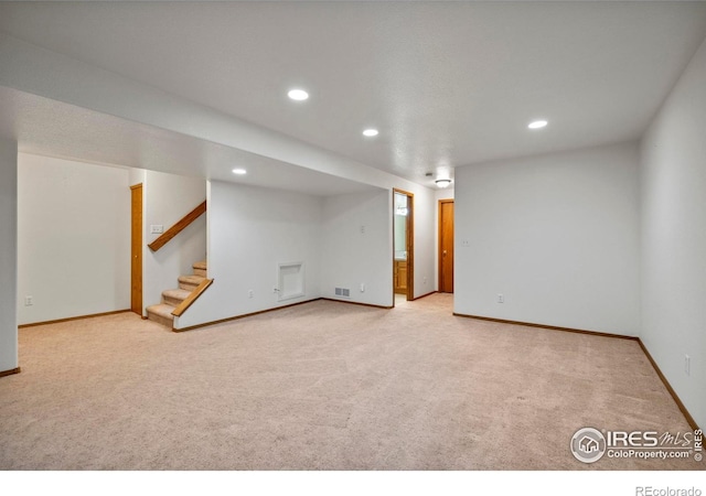2476 Forsythia Dr, Loveland, CO 80537 - finished basement featuring carpet floors, recessed lighting, visible vents, and stairs