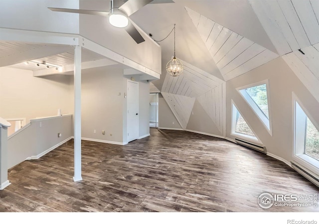 387 Millionaire Dr E, Boulder, CO 80302 - bonus room with a baseboard heating unit, healthy amount of natural light, wood finished floors, baseboards, and lofted ceiling