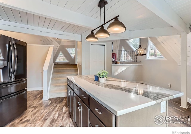 387 Millionaire Dr E, Boulder, CO 80302 - kitchen featuring stainless steel refrigerator with ice dispenser, wood ceiling, wood finished floors, baseboards, and light stone counters