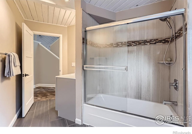 387 Millionaire Dr E, Boulder, CO 80302 - bathroom with enclosed tub / shower combo, baseboards, and wood ceiling