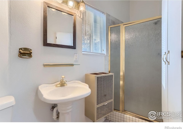 387 Millionaire Dr E, Boulder, CO 80302 - bathroom with a shower stall, toilet, and a sink
