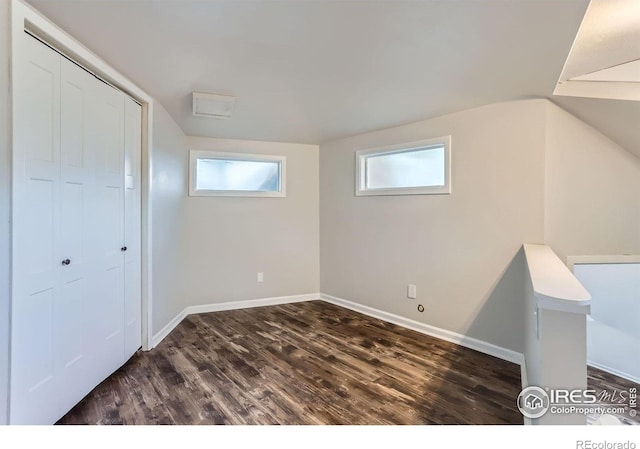 387 Millionaire Dr E, Boulder, CO 80302 - basement with healthy amount of natural light, dark wood finished floors, and baseboards
