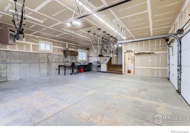 387 Millionaire Dr E, Boulder, CO 80302 - garage featuring a garage door opener