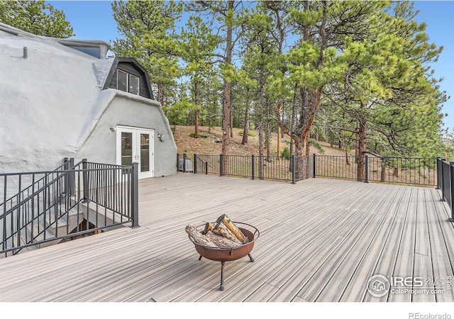 387 Millionaire Dr E, Boulder, CO 80302 - wooden terrace with an outdoor fire pit, french doors, and stairs