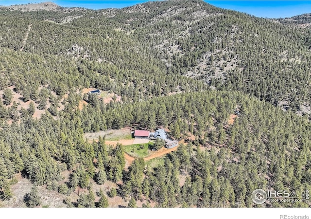 387 Millionaire Dr E, Boulder, CO 80302 - view of property location featuring a forest and mountains