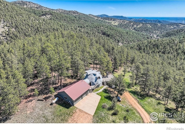 387 Millionaire Dr E, Boulder, CO 80302 - view from above of property featuring a forest and a mountain backdrop