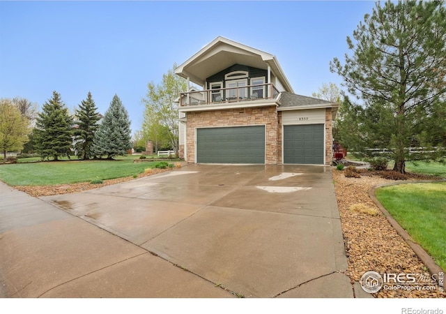 8355 Louden Circle Ft, Collins, CO 80528 - view of front of house with an attached garage, stone siding, a front yard, a balcony, and driveway