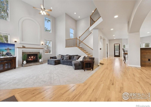 8355 Louden Circle Ft, Collins, CO 80528 - living area featuring a wealth of natural light, a ceiling fan, and a towering ceiling