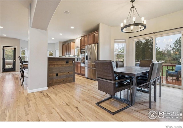 8355 Louden Circle Ft, Collins, CO 80528 - dining room featuring recessed lighting, baseboards, light wood finished floors, and a notable chandelier