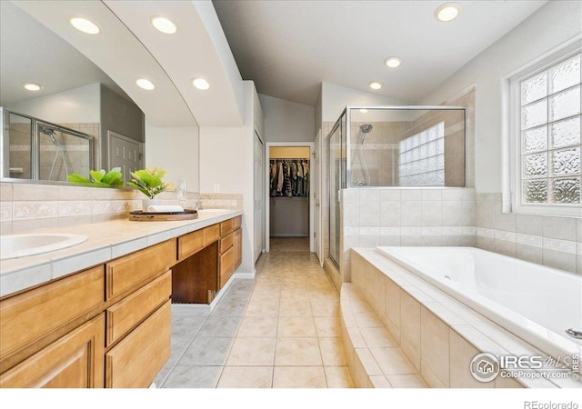 8355 Louden Circle Ft, Collins, CO 80528 - bathroom with recessed lighting, a spacious closet, a sink, and a stall shower