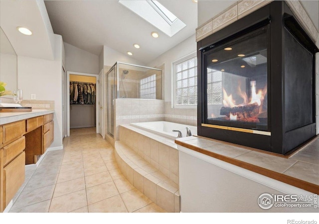 8355 Louden Circle Ft, Collins, CO 80528 - bathroom featuring a bath, a walk in closet, tile patterned flooring, and a stall shower
