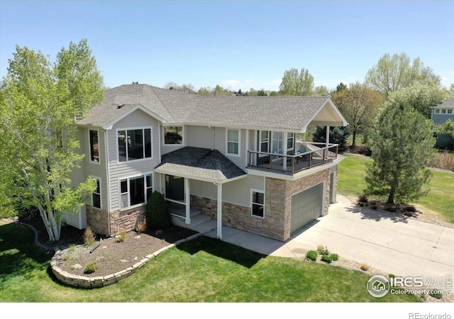 8355 Louden Circle Ft, Collins, CO 80528 - view of front of home featuring a garage, a front yard, stone siding, a shingled roof, and driveway