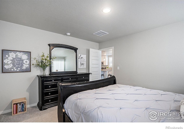403 11th Ave, Wiggins, CO 80654 - carpeted bedroom with baseboards, visible vents, and multiple windows