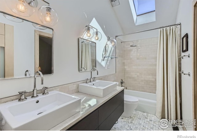 912 Sailors Reef Ft, Collins, CO 80525 - full bath featuring a skylight, toilet, shower / bath combo with shower curtain, and double vanity