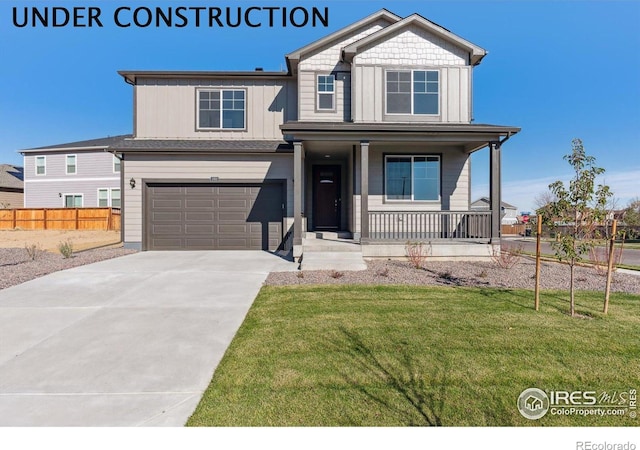5945 Amerifax Dr, Windsor, CO 80528 - view of front of house with a porch, driveway, a front yard, a garage, and fence