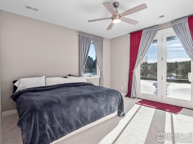 bedroom featuring carpet floors, a ceiling fan, access to exterior, and visible vents