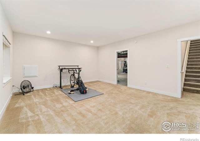exercise area with recessed lighting, carpet, and baseboards
