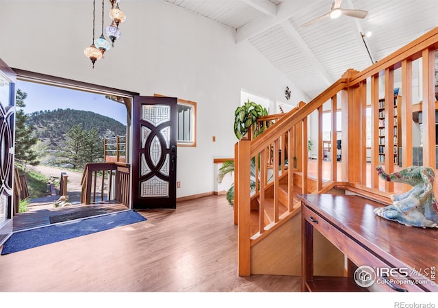 2345 Point Of Pines Dr, Boulder, CO 80302 - foyer entrance with high vaulted ceiling, stairs, baseboards, wood finished floors, and beamed ceiling
