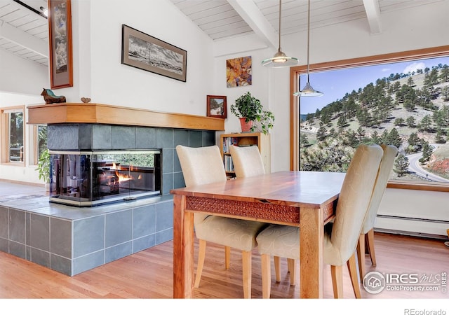 2345 Point Of Pines Dr, Boulder, CO 80302 - dining space featuring baseboard heating, wooden ceiling, vaulted ceiling with beams, and wood finished floors