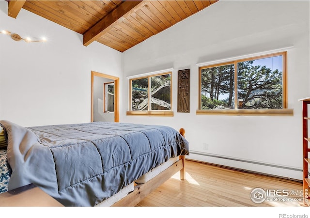 2345 Point Of Pines Dr, Boulder, CO 80302 - bedroom featuring wooden ceiling, vaulted ceiling with beams, a baseboard radiator, and wood finished floors