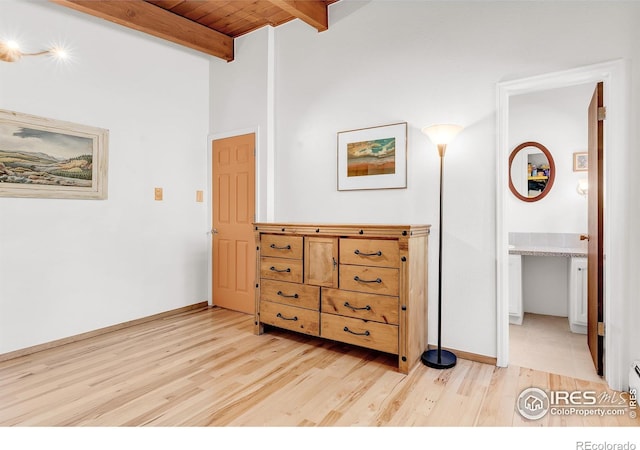 2345 Point Of Pines Dr, Boulder, CO 80302 - bedroom with beamed ceiling, baseboards, and light wood-style floors