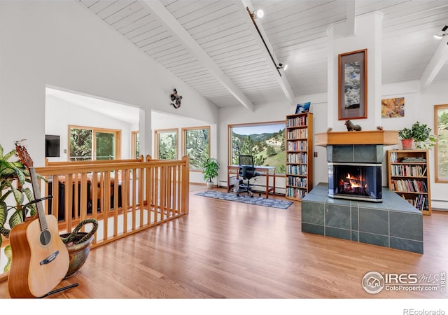 2345 Point Of Pines Dr, Boulder, CO 80302 - living room featuring plenty of natural light, wood finished floors, and a tile fireplace