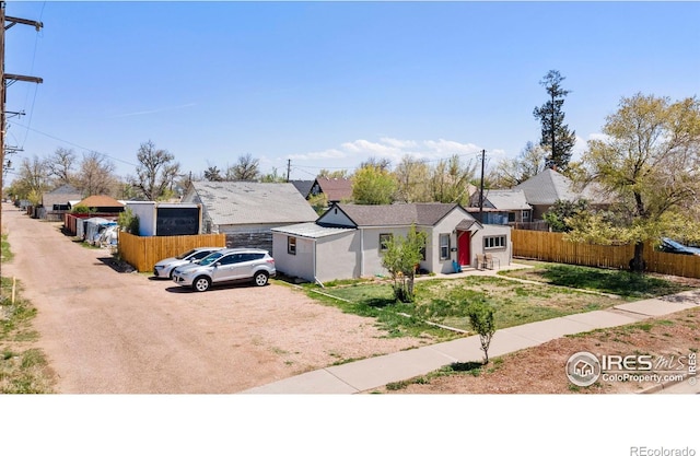 316 14th Ave, Greeley, CO 80631 - view of front of home featuring dirt driveway and fence