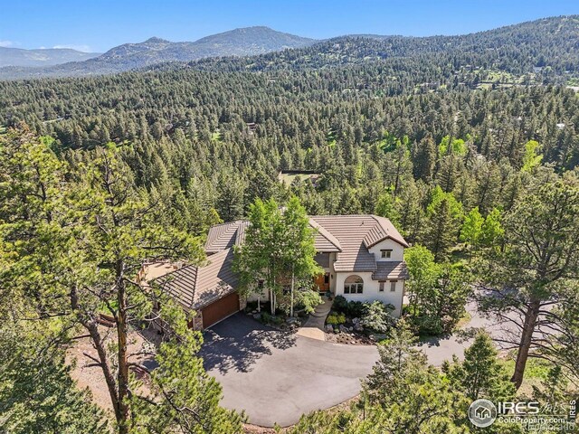 27921 Alabraska Ln, Evergreen, CO 80439 - aerial view of property and surrounding area with a forest and a mountainous background