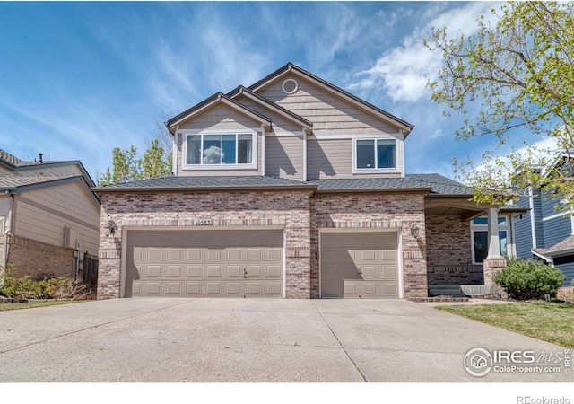 10583 Oakmoor Cir, Parker, CO 80134 - view of front facade with brick siding, driveway, and a garage