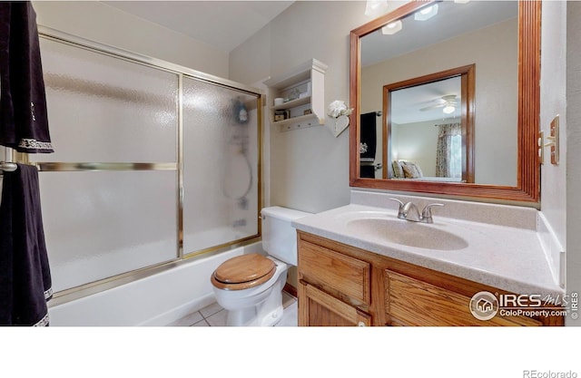 729 Jay Pl, Berthoud, CO 80513 - bathroom featuring vanity, shower / bath combination with glass door, tile patterned floors, and toilet