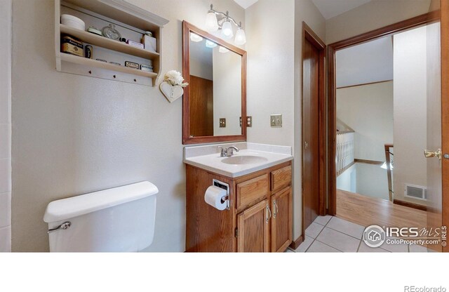 729 Jay Pl, Berthoud, CO 80513 - bathroom featuring vanity, tile patterned flooring, toilet, and visible vents