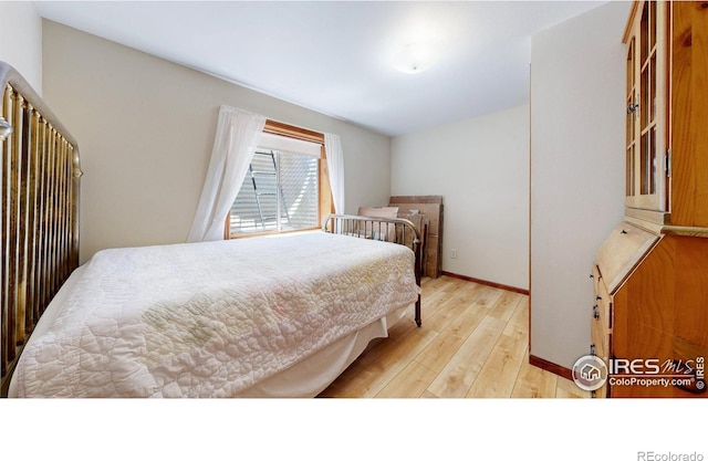 729 Jay Pl, Berthoud, CO 80513 - bedroom featuring baseboards and light wood-style flooring