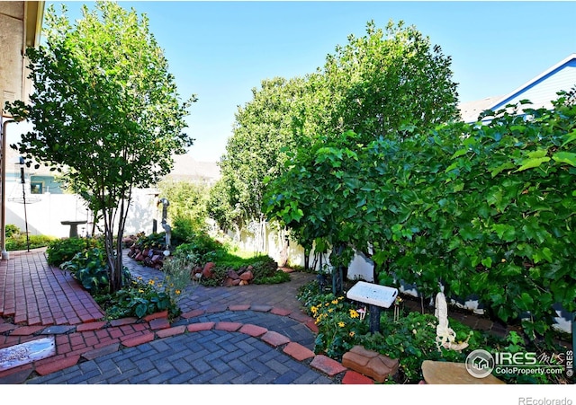 view of patio featuring fence