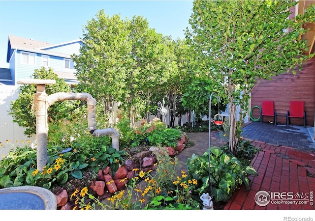 deck with a patio and fence