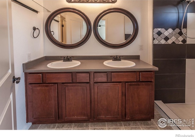 bathroom featuring double vanity and a sink