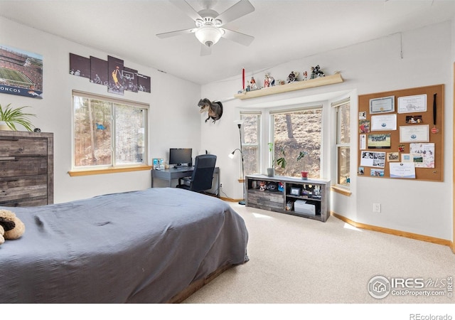 139 Ponderosa Dr, Nederland, CO 80466 - carpeted bedroom with multiple windows, baseboards, and ceiling fan