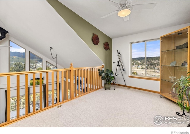 139 Ponderosa Dr, Nederland, CO 80466 - unfurnished room featuring ceiling fan, carpet, baseboards, vaulted ceiling, and a mountain view