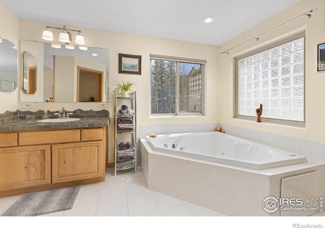 139 Ponderosa Dr, Nederland, CO 80466 - full bathroom featuring a jetted tub, tile patterned floors, vanity, and recessed lighting