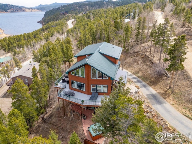 139 Ponderosa Dr, Nederland, CO 80466 - view of subject property featuring a water and mountain view and a heavily wooded area