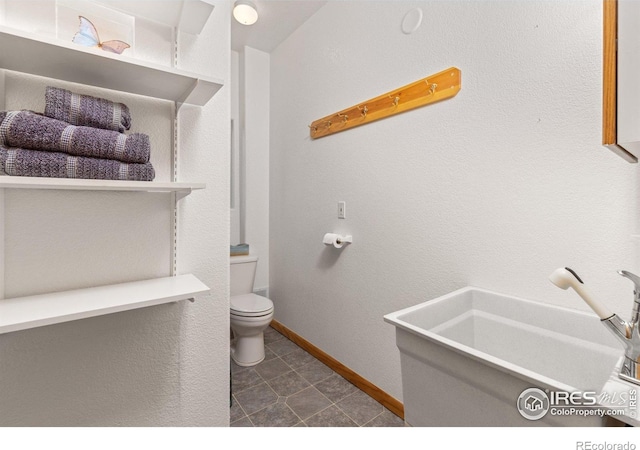 139 Ponderosa Dr, Nederland, CO 80466 - bathroom featuring toilet and baseboards