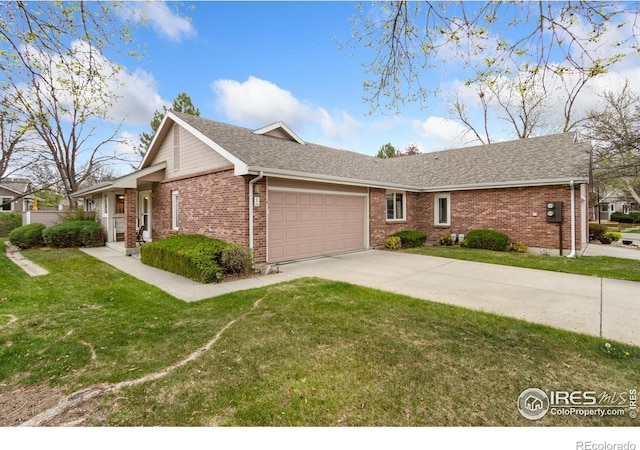 3500 Carlton Ave Unit 34, Fort Collins, CO 80525 - ranch-style home with driveway, a garage, brick siding, and a front yard