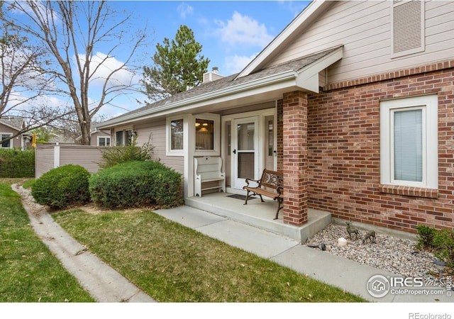 3500 Carlton Ave Unit 34, Fort Collins, CO 80525 - property entrance with a chimney and brick siding