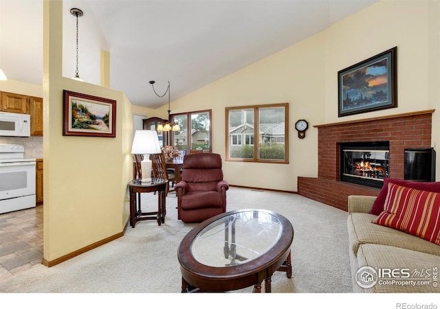 3500 Carlton Ave Unit 34, Fort Collins, CO 80525 - living area with light colored carpet, an inviting chandelier, vaulted ceiling, and baseboards