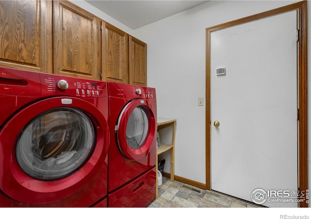 3500 Carlton Ave Unit 34, Fort Collins, CO 80525 - laundry area with cabinet space, independent washer and dryer, baseboards, and stone finish floor