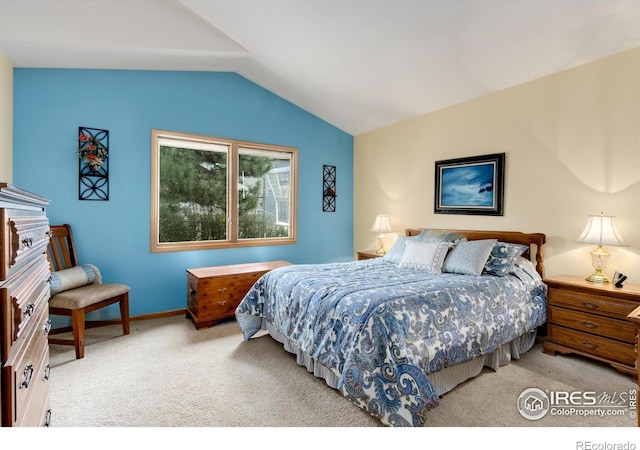 3500 Carlton Ave Unit 34, Fort Collins, CO 80525 - carpeted bedroom with baseboards and lofted ceiling