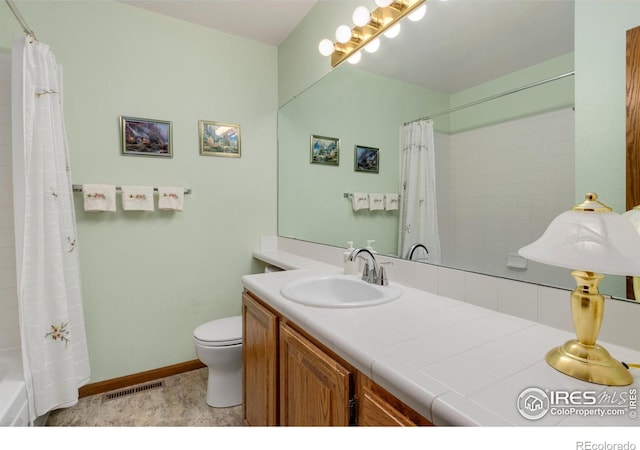 3500 Carlton Ave Unit 34, Fort Collins, CO 80525 - full bathroom with shower / bath combo with shower curtain, toilet, baseboards, visible vents, and vanity