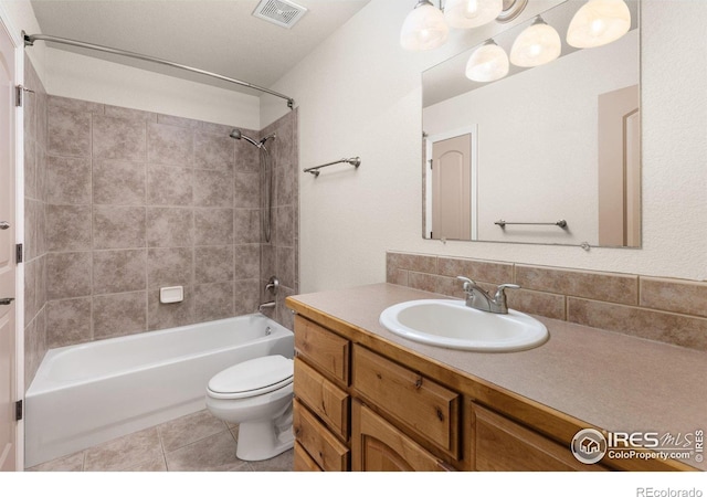 7548 County Road 100, Wellington, CO 80549 - bathroom featuring  shower combination, toilet, vanity, tile patterned floors, and backsplash