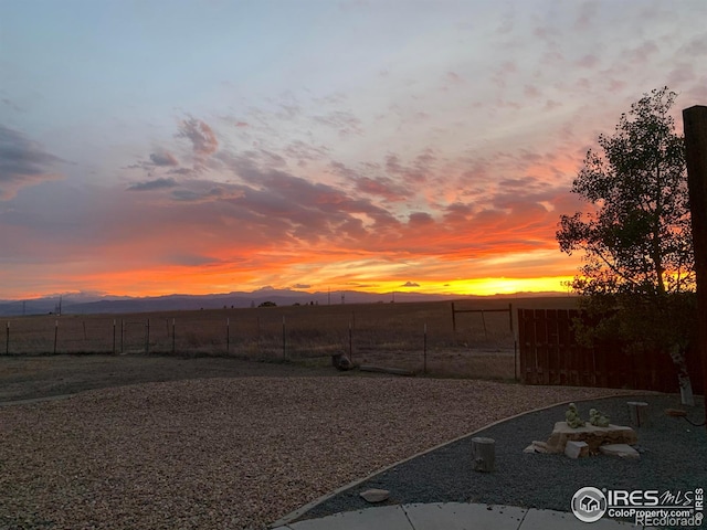 7548 County Road 100, Wellington, CO 80549 - yard at dusk with fence