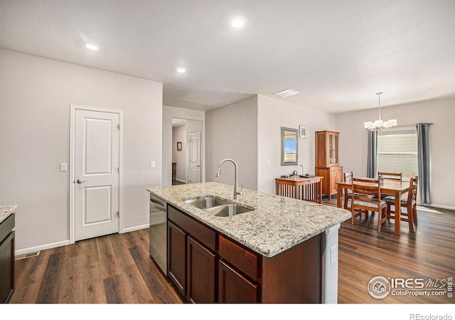 kitchen featuring a sink, an inviting chandelier, stainless steel dishwasher, and dark wood-style floors