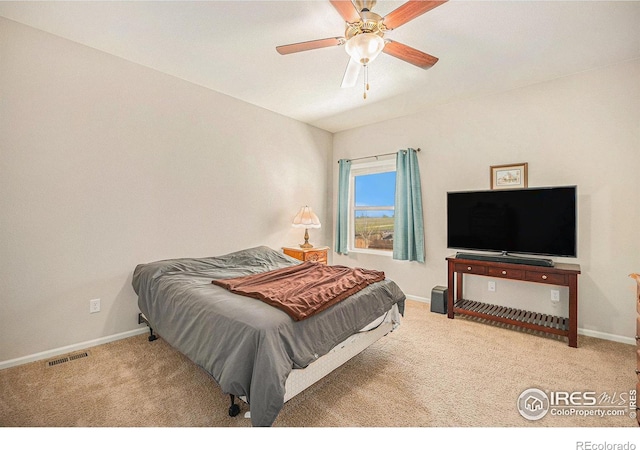 bedroom with baseboards, carpet flooring, and visible vents